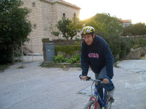 Me on my $40 bike that I bought here, with our apartment building in the background