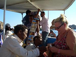 Egyptian merchants hopped on our boat to try and sell us their goods.