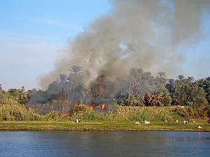 Farmers burning their harvested farmland, to prepare for the next planting. Apparently, this is against the law, but doesn't get enforced very well.