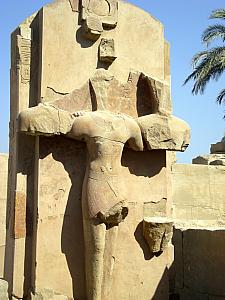 This was an example of how the Christians defaced the pagan Egyptian sculptures in the 300s AD. They cut out everything except for the shape of a cross, to better suit their imagery.