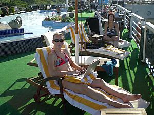 Kelly and Mom Klocke sunbathing atop our cruise ship! Kelly's hard at work on her daily diary.