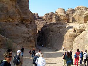 The entrance to the Siq up ahead. The Siq is like a gorge. In ancient times, an earthquake split the mountain in two, leaving a gap that winds through the mountain for about two-thirds of a mile. The gap is 10-20 feet wide in most places