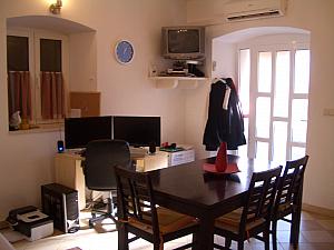 A look at our nice big kitchen table. It has six chairs, but we've moved them around the apartment because we don't need all six there taking up space. And that's my "office" against the wall. I'm happy that we can now live and work in the same space since we were living and working in a tiny room the past couple months!