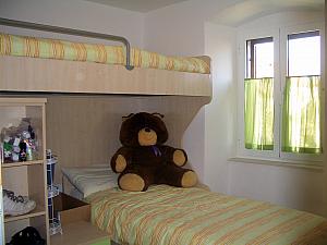 Our second bedroom - with bunk beds! And a giant stuffed bear.