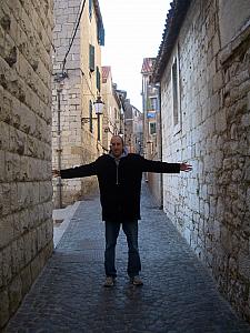 Giving you perspective of the width of our street. I can almost touch both buildings on either side of the street!