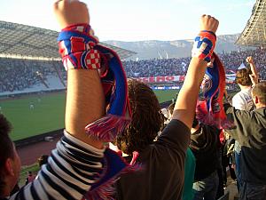 Cheering for Hajduk - many fans have these scarfs.