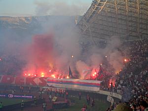LOTS. I think in the 15 minutes after the goal, about 40 flares  were lit up. A few made their way onto the pitch. 
