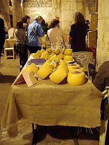 Back in the basement, they were having a market of sorts -- lots of cheese wheels here!