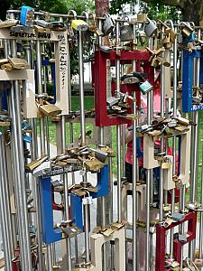 Couples in love buy a padlock, write their initials on it, lock it on this gate, and throw the key in the Danube River as a sign of commitment to one another.