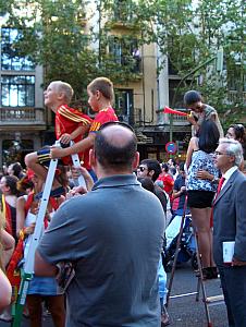 We were amused to see many step-ladders out lining the streets so that short people and kids can see over the crowd.