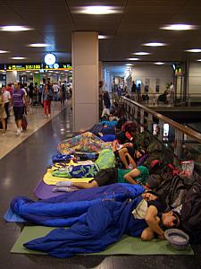 At Madrid Barajas airport, at about 4:45am for or 6:30am flight. Hundreds of people camping out sleeping on the floor! The subway from Madrid to the airport shuts down between midnight and 6am, so many backpackers catch the midnight subway and camp out at the airport overnight to avoid another night's lodging fees and the expensive middle-of-the-night taxi ride. (We went middle-of-the-road and booked a shared-taxi.)
