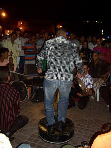 Dancer / musician. Playing some sort of percussion with his feet. He ran after us for a tip immediately after we took this photo...