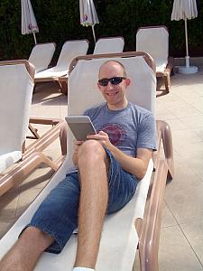 Jay reading his Kindle at the pool