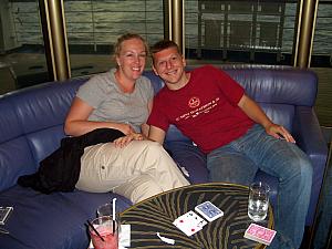 Kyleen and Kevin playing cards during happy hour on the ship.