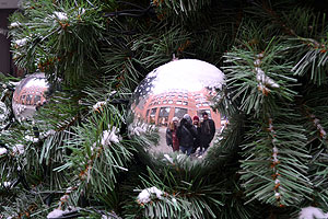 Group photo via Christmas tree ornament reflection