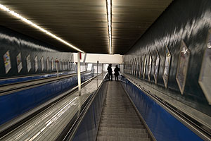Riding the escalator down into the subway station