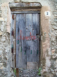 a run down door in Cuenca that serves little purpose since there is a big hole beneath the door. I guess it does provide some privacy.