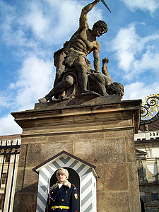 a guard in front of a statue at the castle