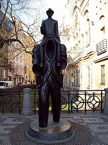 Franz Kafka Statue - In his early short story "Description of a Struggle" Kafka wrote of a young man riding on another man's shoulders through the streets of Prague. 