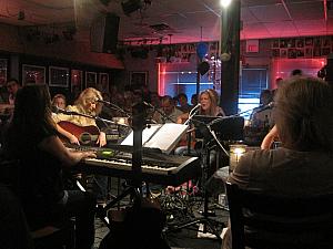 Enjoying a fantastic show at the Bluebird Cafe, watching four aspiring singer-songwriters perform acoustic songs while eating dinner