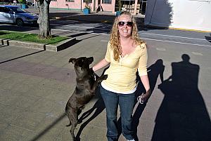 Puerto Montt, chile - Kyleen greeting a dog - several of the towns we visited had many wild dogs