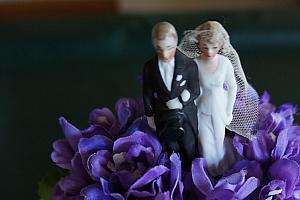 A pretty wedding cake made out of towels; the cake topper was used on Kelly's grandsparents' wedding cake.