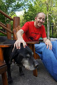 Jay petting a four-legged friend. Poor guy was old and hobbled, but very friendly.