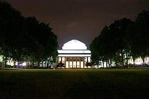 A more traditional building, nicely lit up, on MIT's campus.