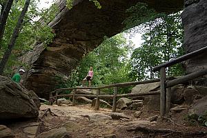Kelly providing a frame of reference for the impressive Natural Bridge