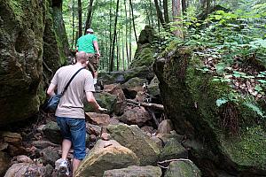 Scrambling over some fallen rocks.