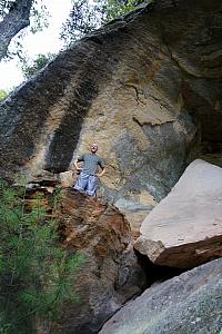 Jay seizing another opportunity to scramble up a hillside to play on some rocks.