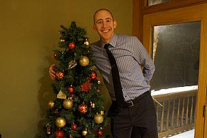 Jay hugging the Christmas tree