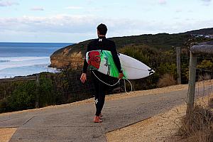 Here's a surfer heading down to the beach.