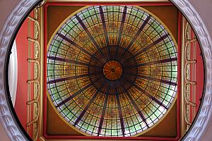 Walking through a mall, a pretty domed ceiling with stained glass windows.