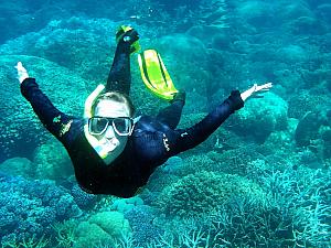 Kyleen diving underwater.