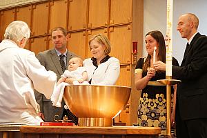 Baptism in progress.