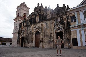 Standing in front of another church - this half of the facade has not been restored from a past fire, but the other half had been.