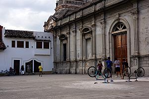 Here's the other half of the church facade, and some local boys playing soccer on the plaza in front of the church, using two upside-down bikes to serve as each goal.