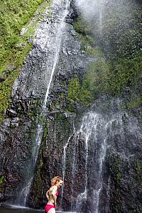 Kelly braving the water in the waterfall's lake basin 