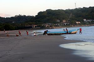 See the log on the left-hand side of this photo? We were sitting on one of two of these logs watching the surfers and the sunset, until a group of children came running up to us yelling Panga! Panga! We didn't know what they meant initially, but learned that they needed to use the logs at the edge of the water to roll the boat onto so that the boat could be pulled out of the water.