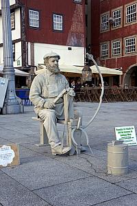 human statue along the riverfront