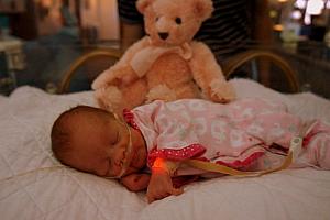 Capri and her first teddy bear.