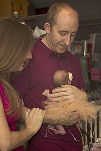 Getting ready to return Capri to her crib (Captured by The Tiny Footprints Project. Thank you!)