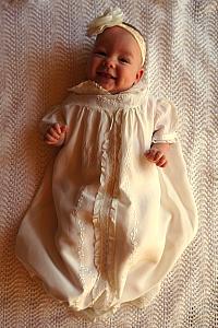 Capri posing in her baptismal gown