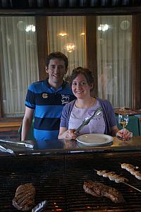 Pete and Dee posing in front of STEAK (and wimpy chicken).