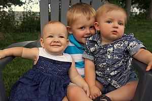 Capri and Benny and Cooper don't quite fit in the chair.