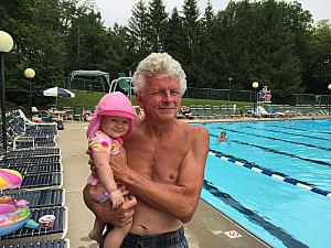 Capri and Grandpa enjoying the pool