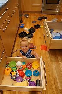 Capri having fun with all the kitchen drawers. Unfortunately, not just her toy drawer.