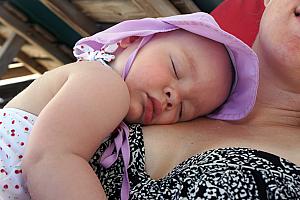 On the beach, Capri was konked out on her mama's lap.