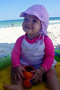 At the beach, playing in an inflatable baby pool